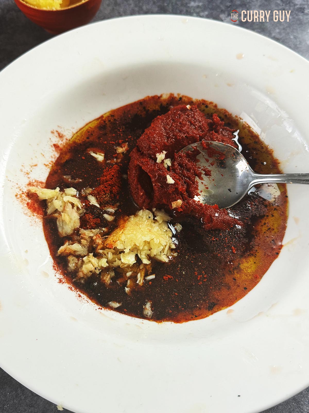 The ingredients for the marinade in a bowl, ready to whisk until smooth.