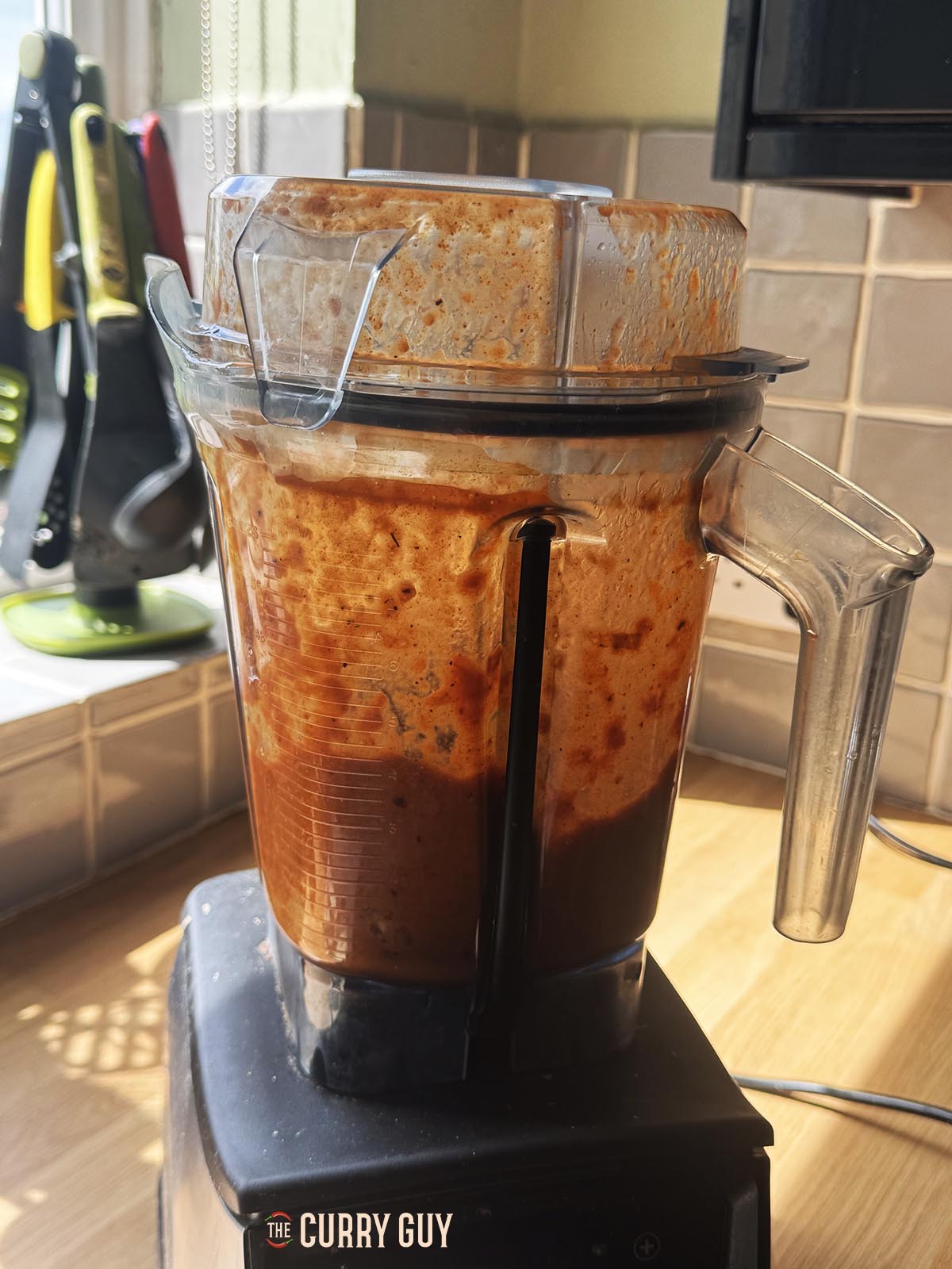 Blending the sauce ingredients in a blender.