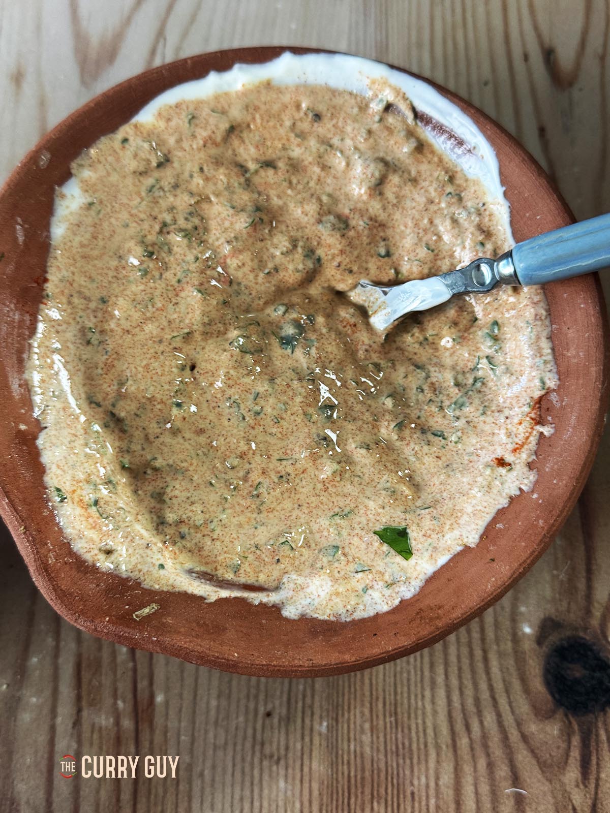 The smooth marinade ready to apply to the chicken.