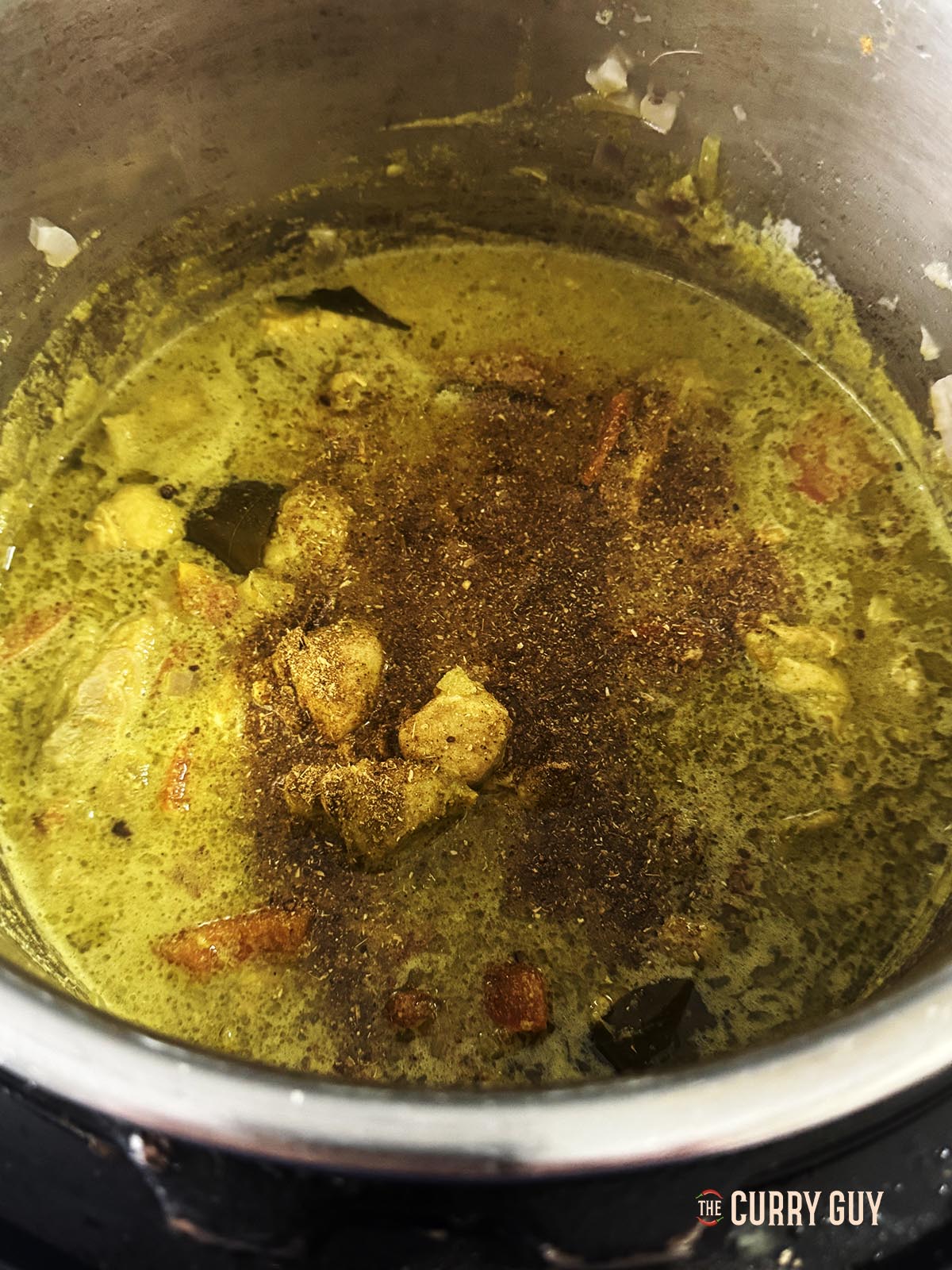 Adding and stirring in the garam masala. 