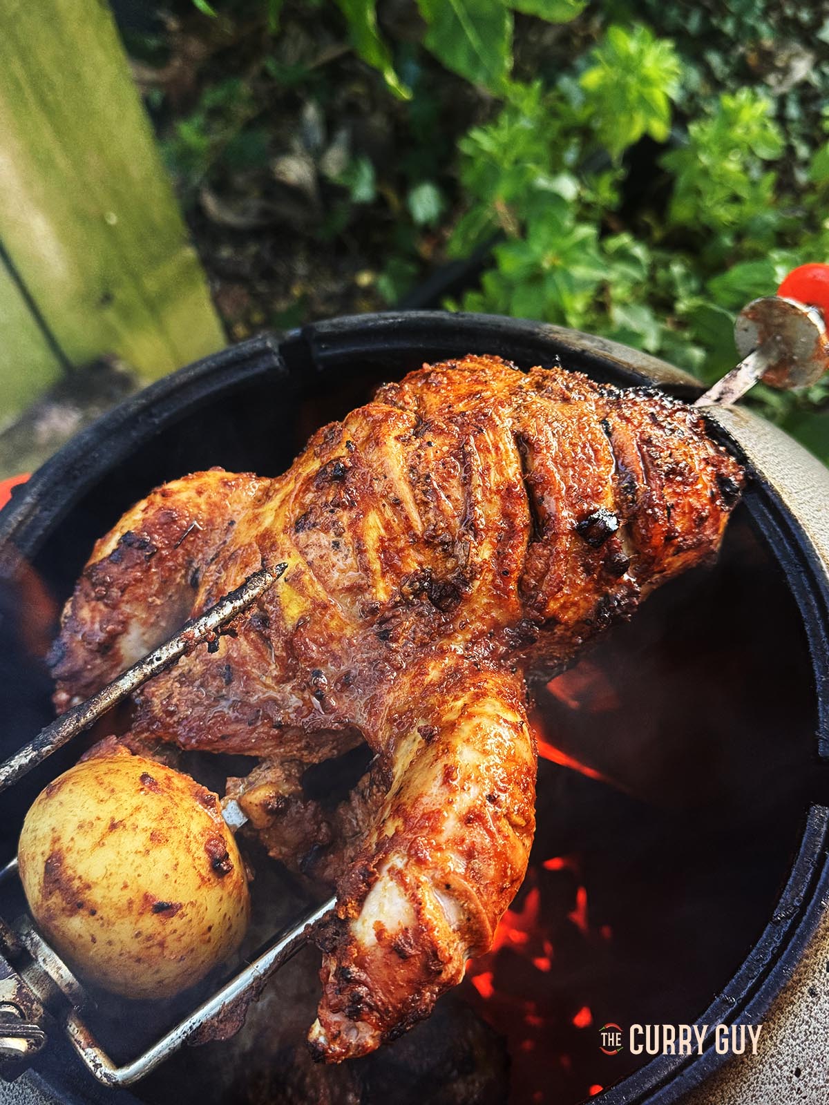 The pheasant cooking over the heat of the tandoor. 