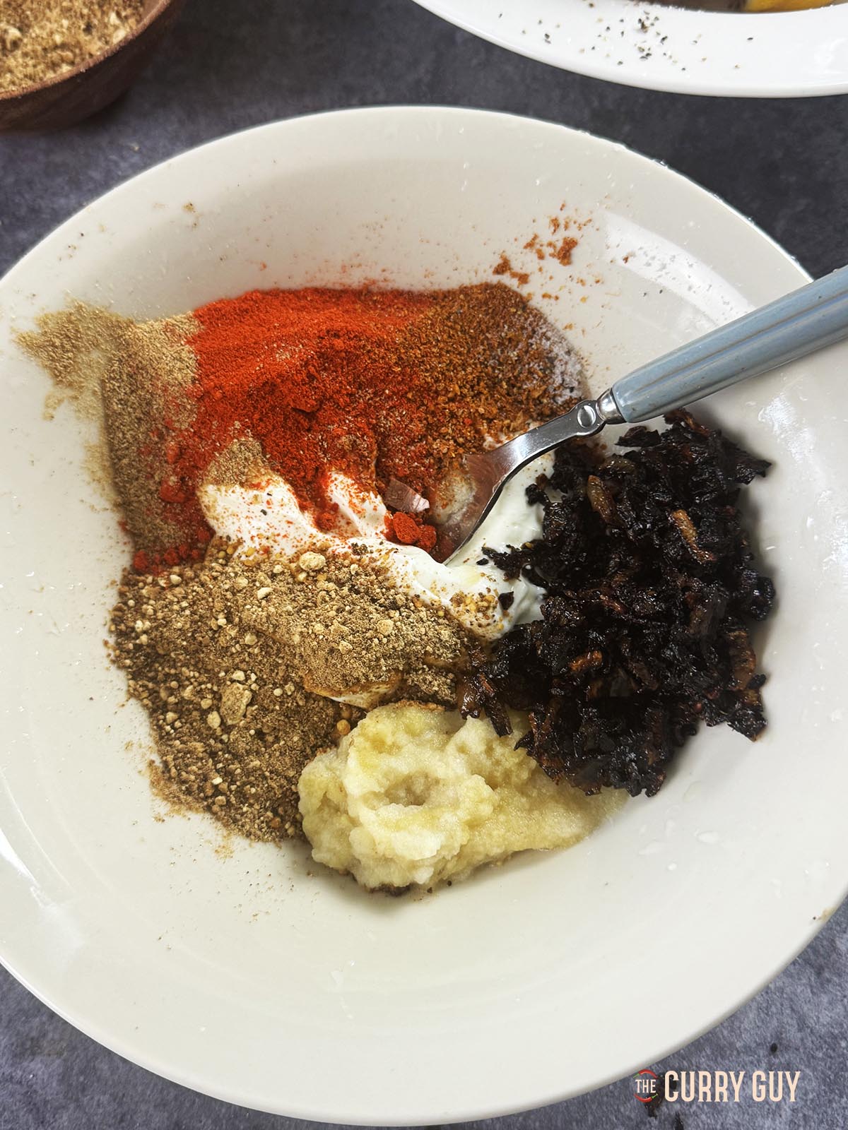 All of the marinade ingredients in a mixing bowl.