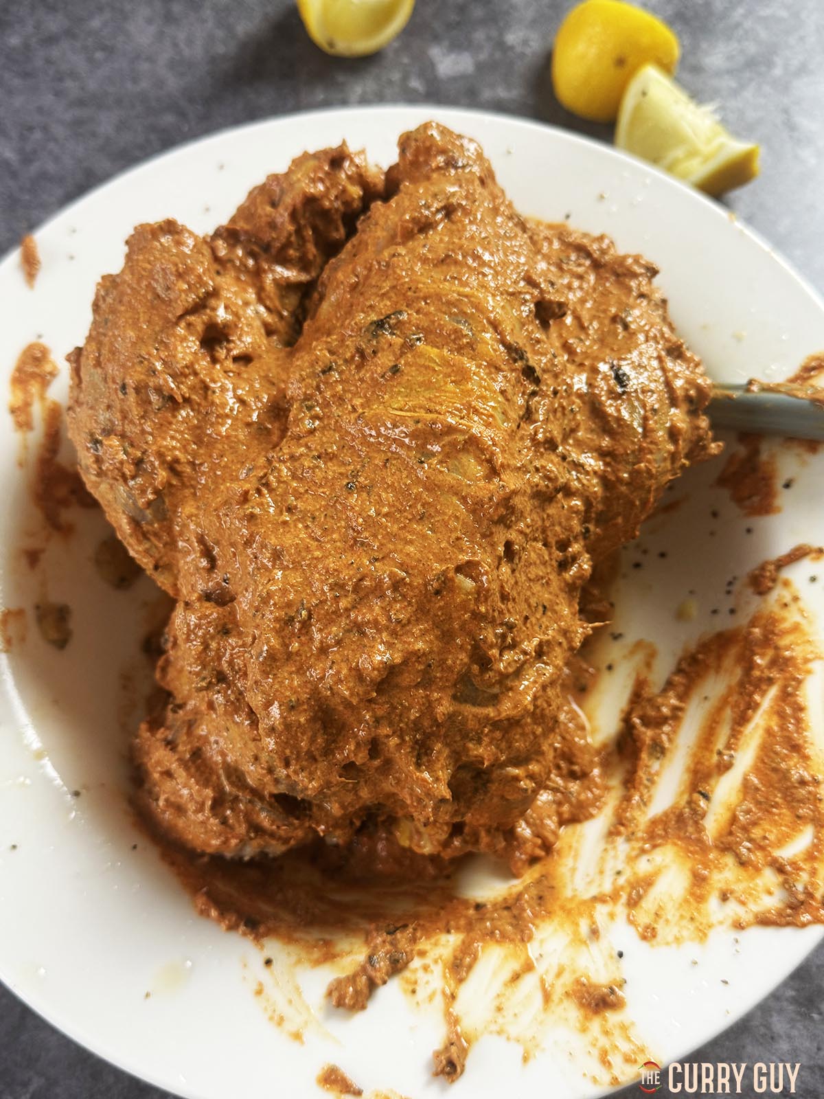 Rubbing the second marinade onto the pheasant. 