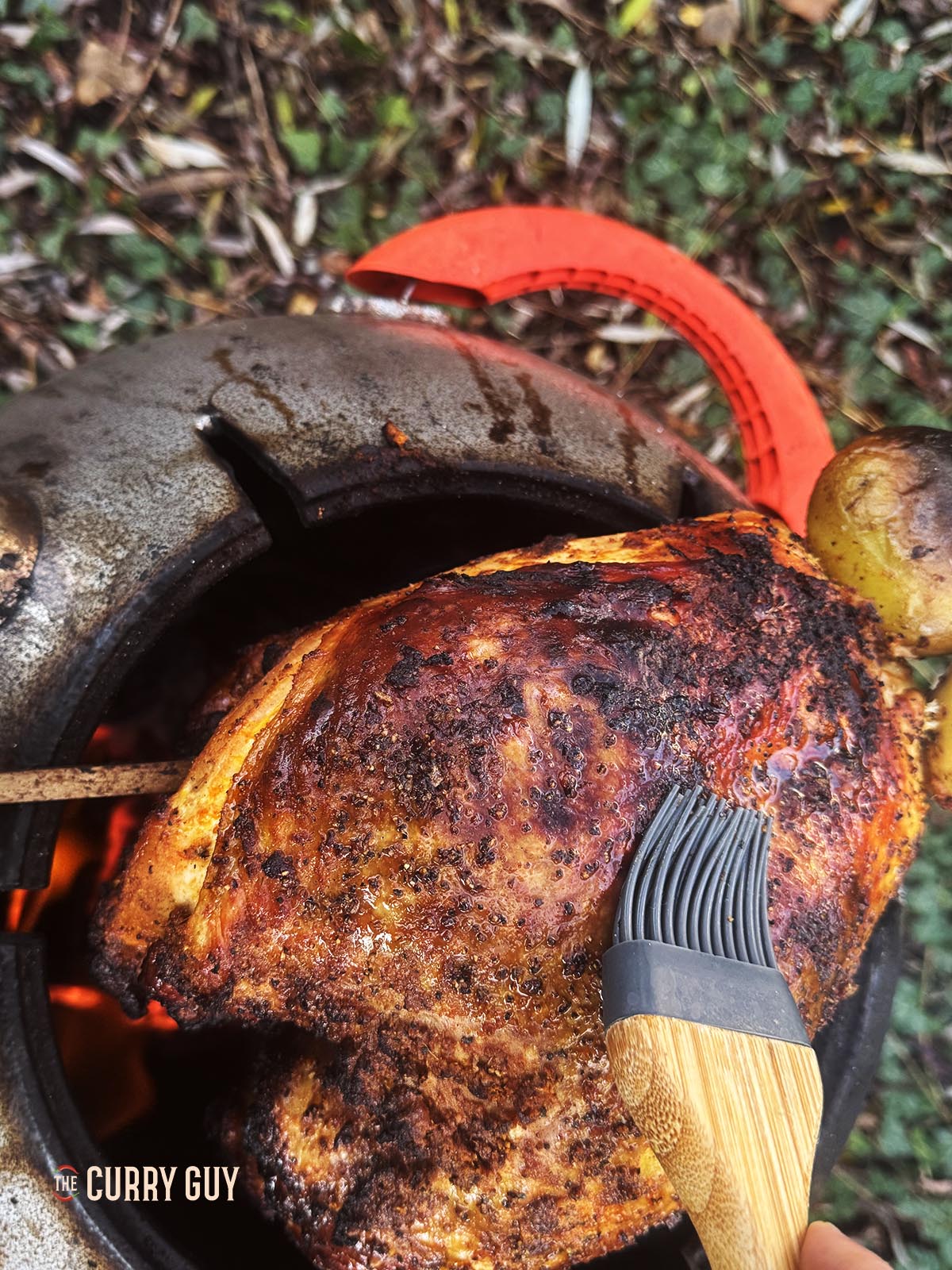 Basting the turkey with butter.