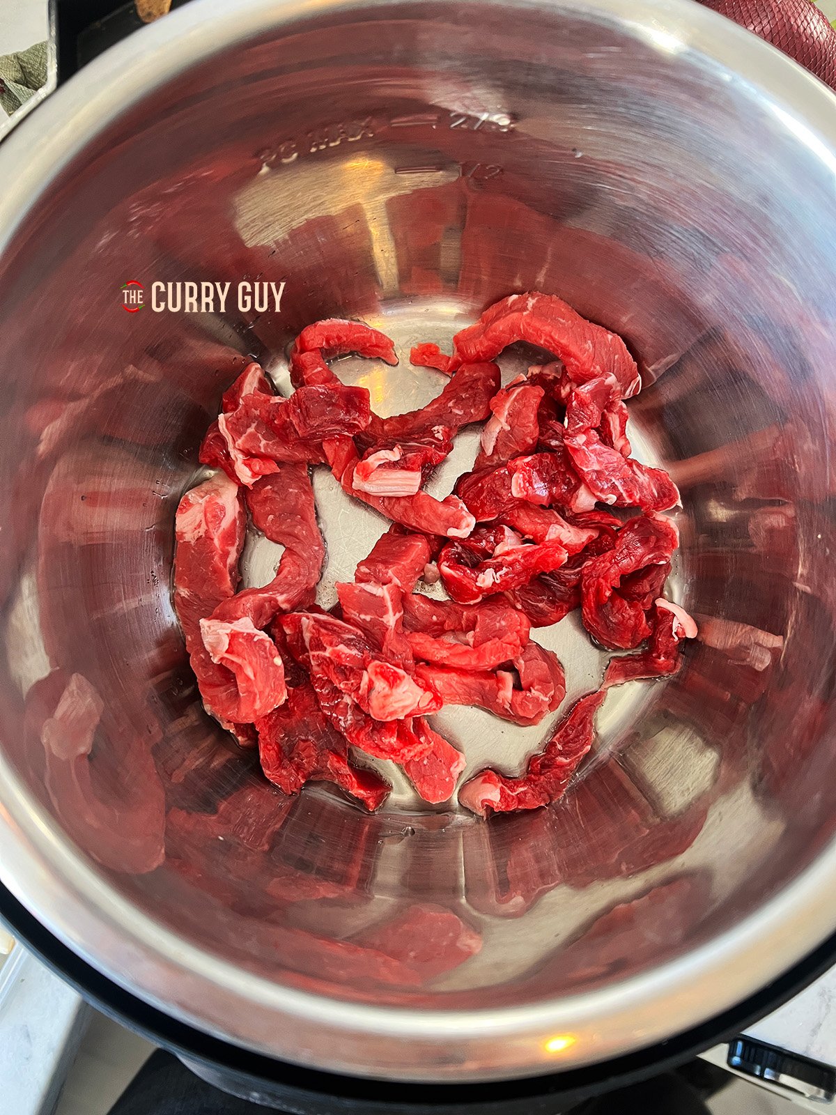 Searing the beef in the slow cooker 