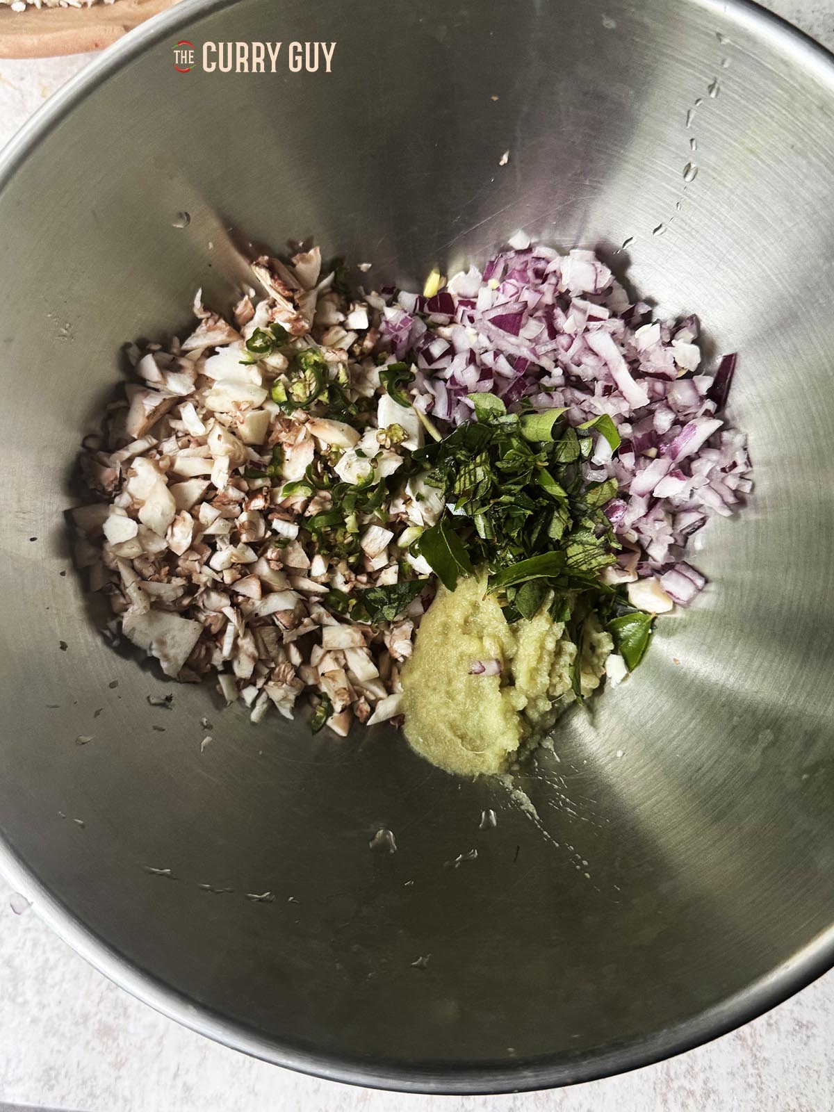 THe stuffing ingredients in a bowl before air frying.