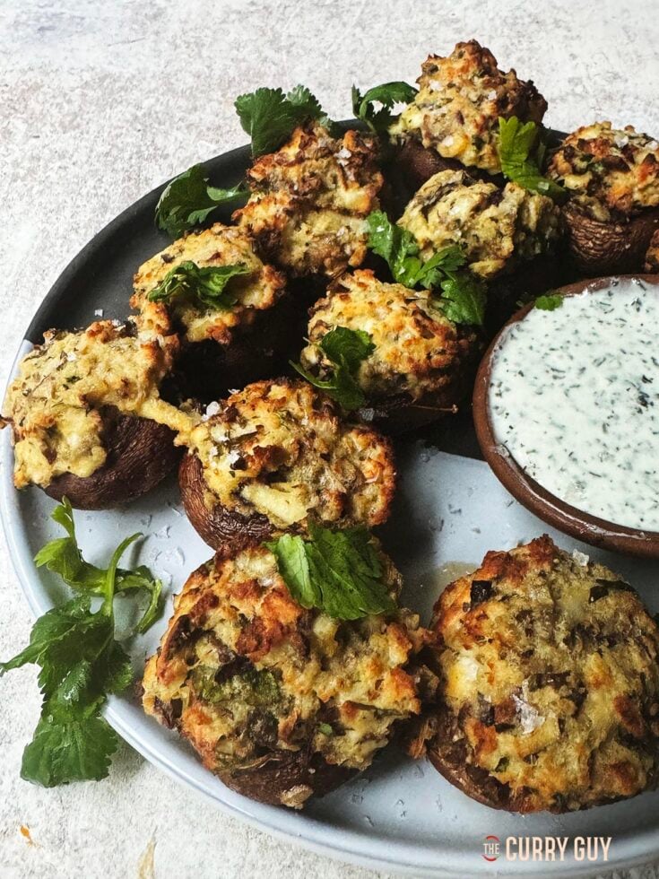 Air fryer tandoori mushrooms on a serving plate with raita.