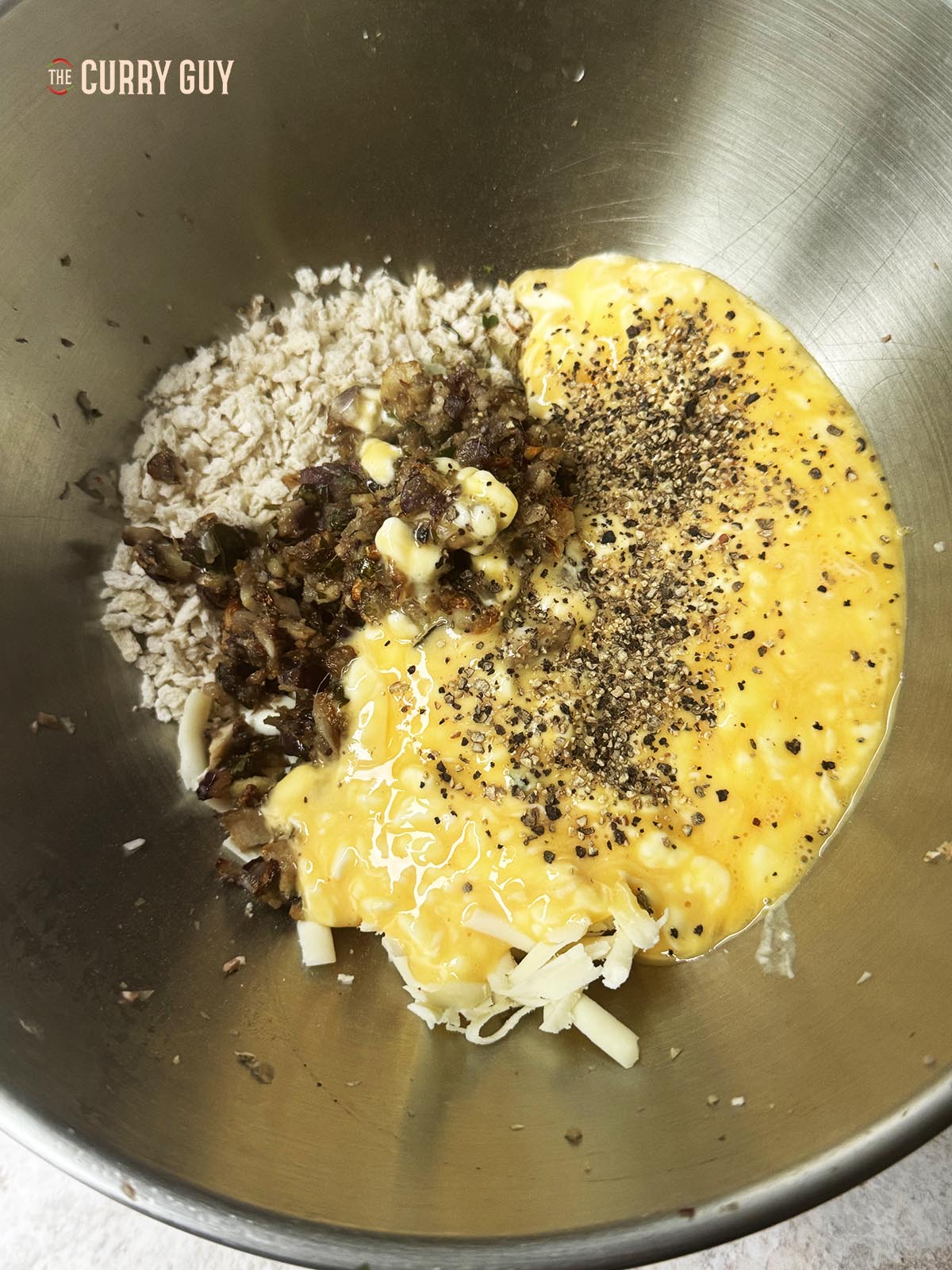 Placing all of the stuffing ingredients in the mixing bowl. 