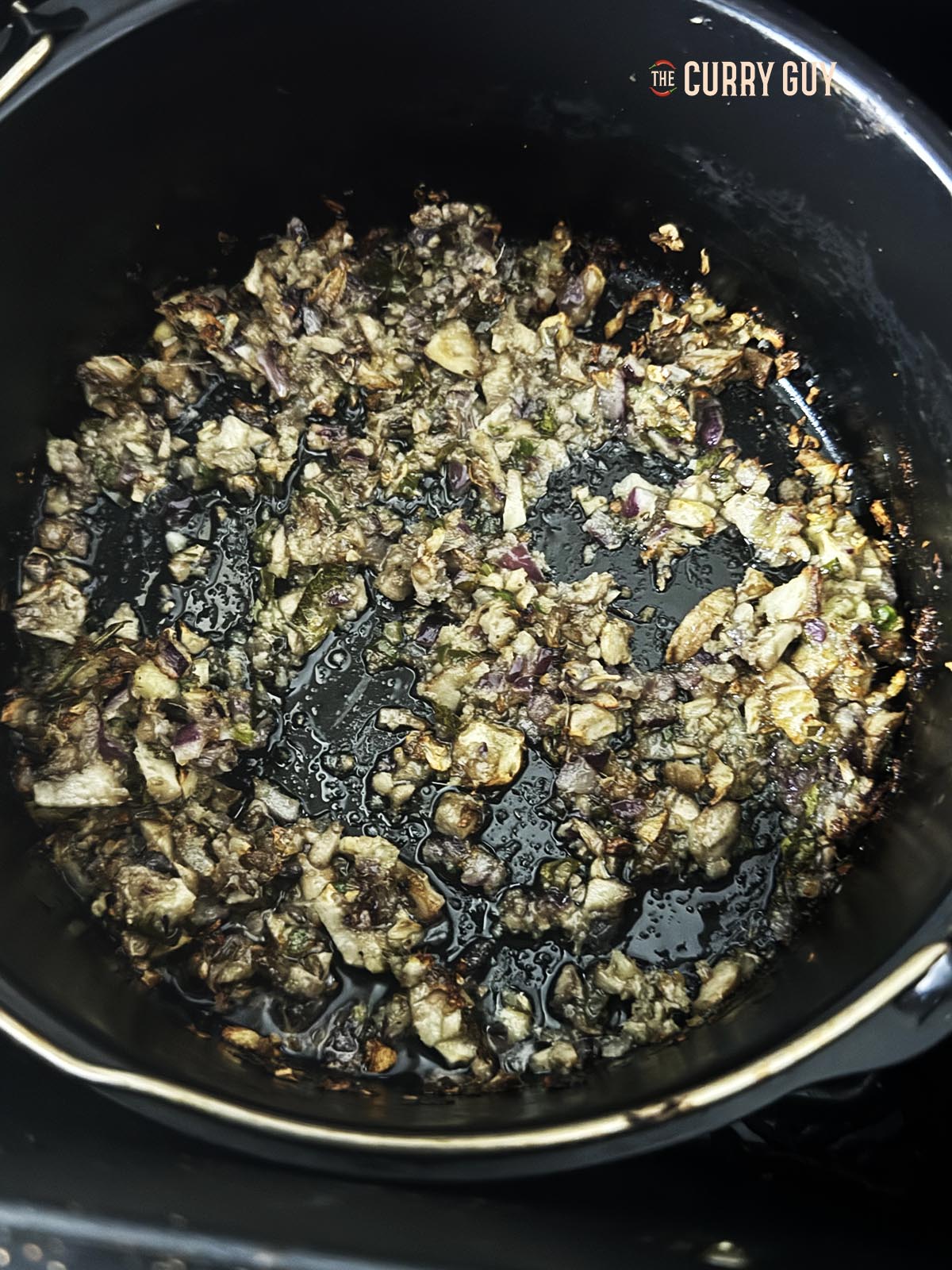 Aiur frying the stuffing ingredients. 