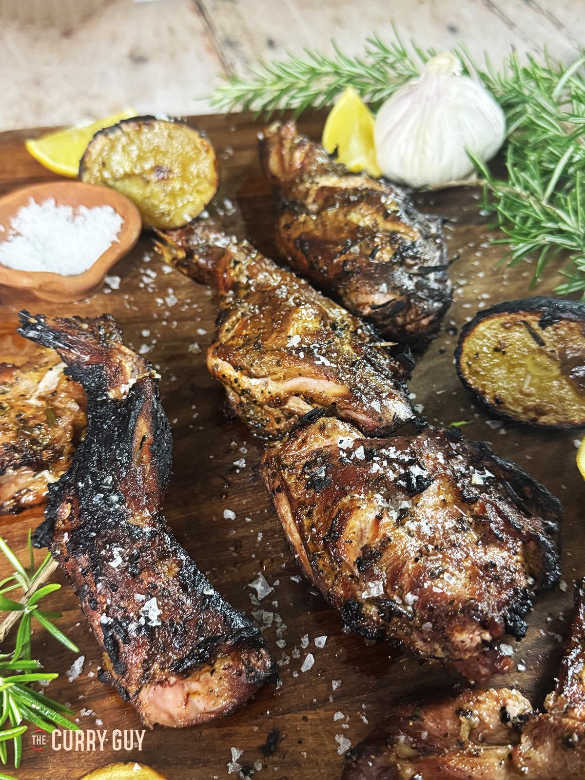 Grilled rabbit on a serving platter.