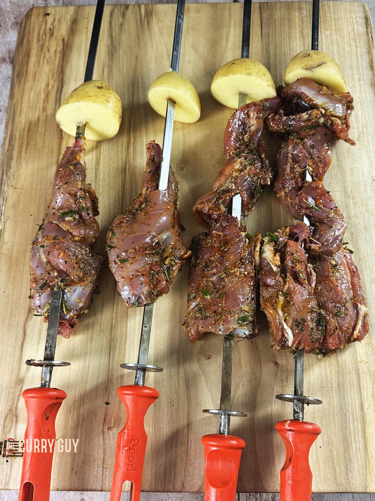 The rabbit on skewers, ready to go in the tandoor oven. 