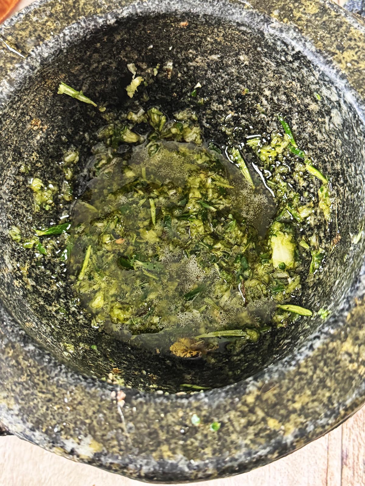 The garlic, herbs and lemon zest pounded to a paste with the olive oil.