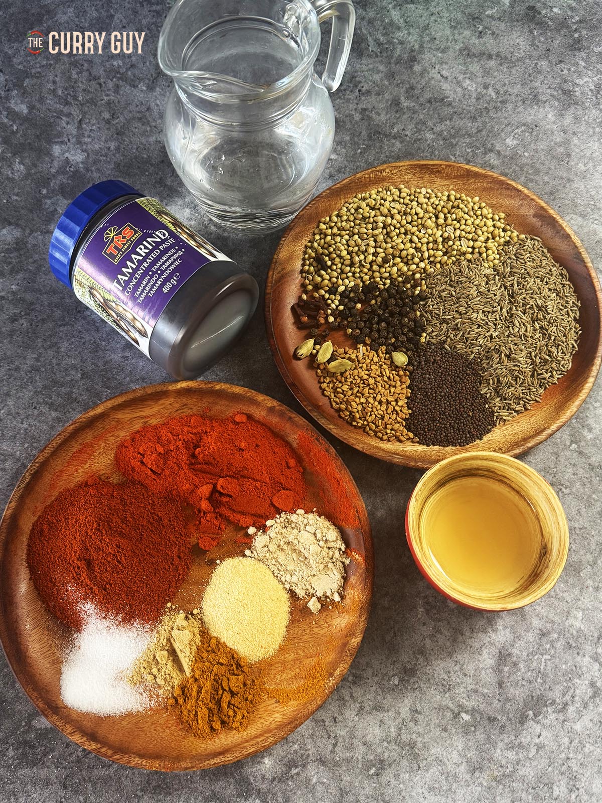 The ingredients for the curry paste laid out on a countertop.