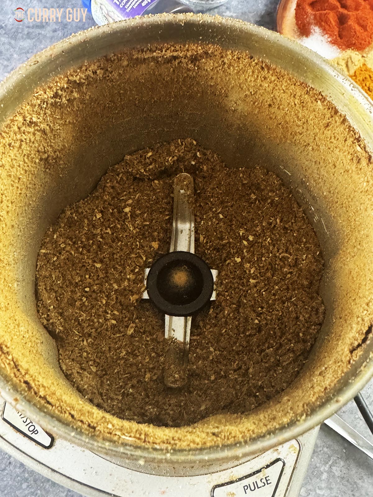 Grinding the spices to a fine powder. 