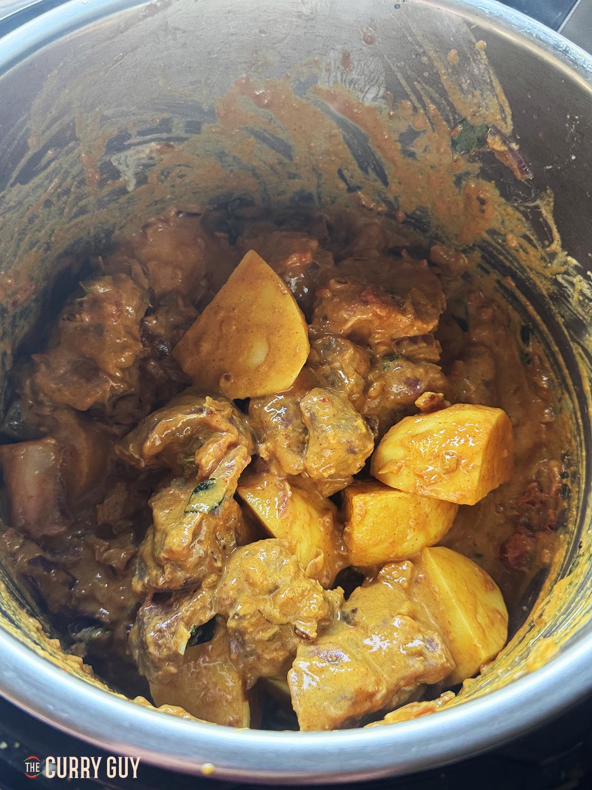 Bringing everything to a simmer in the pot.