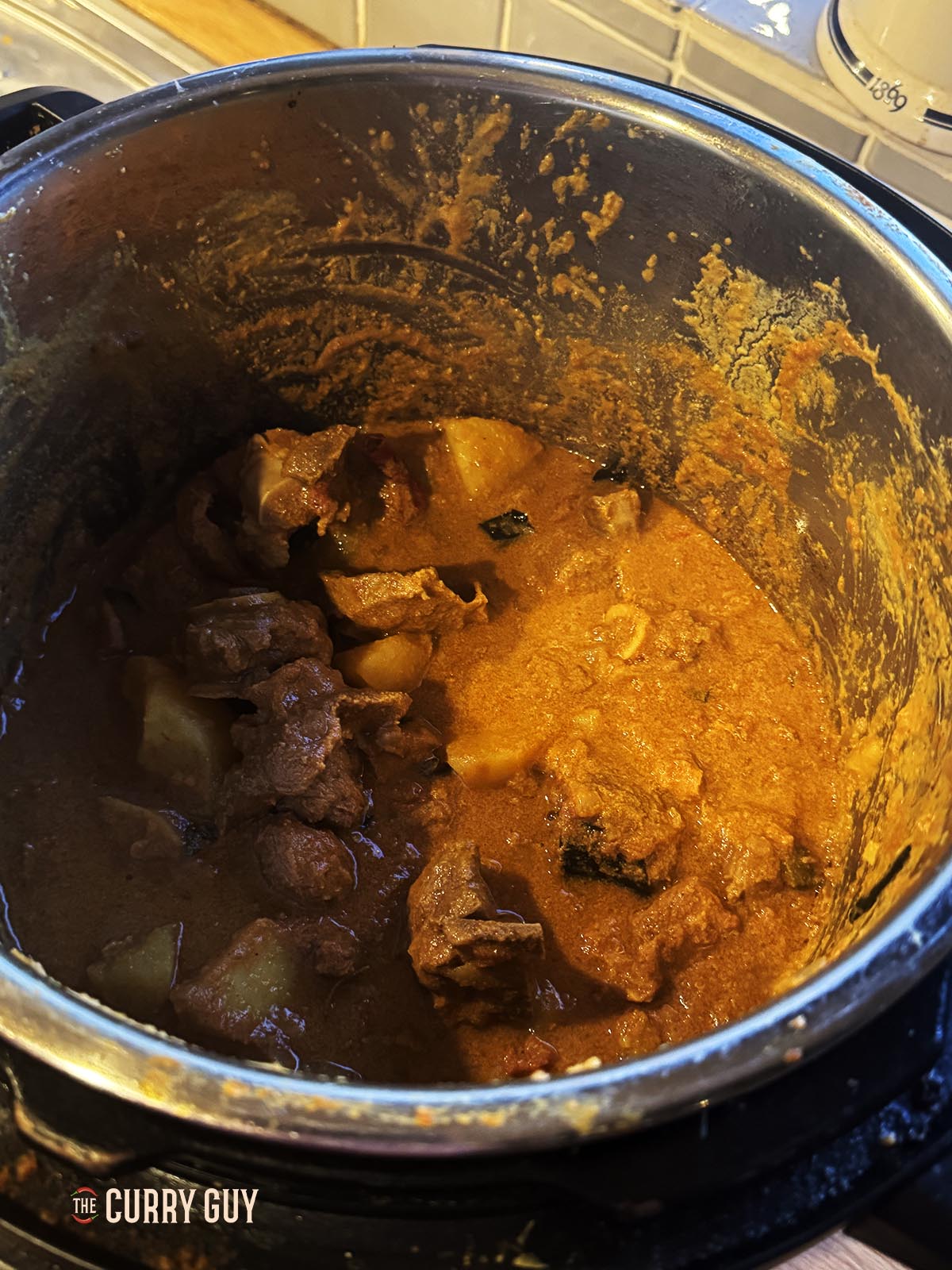 Seasoning the curry before serving.