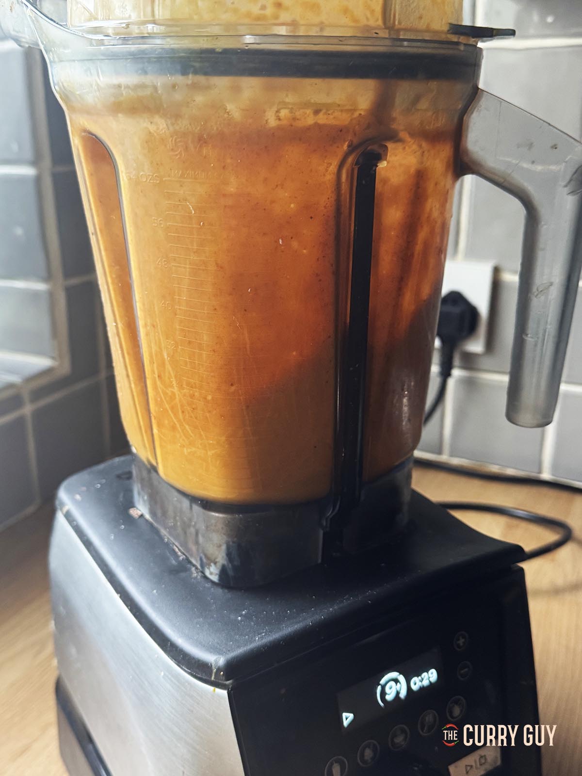 Blending the paste ingredients until smooth in a blender.