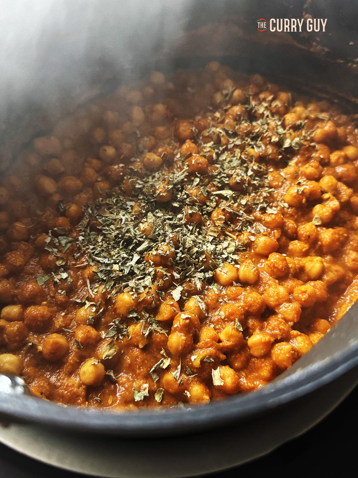 Adding the kasoori methi and seasoning with salt to taste.