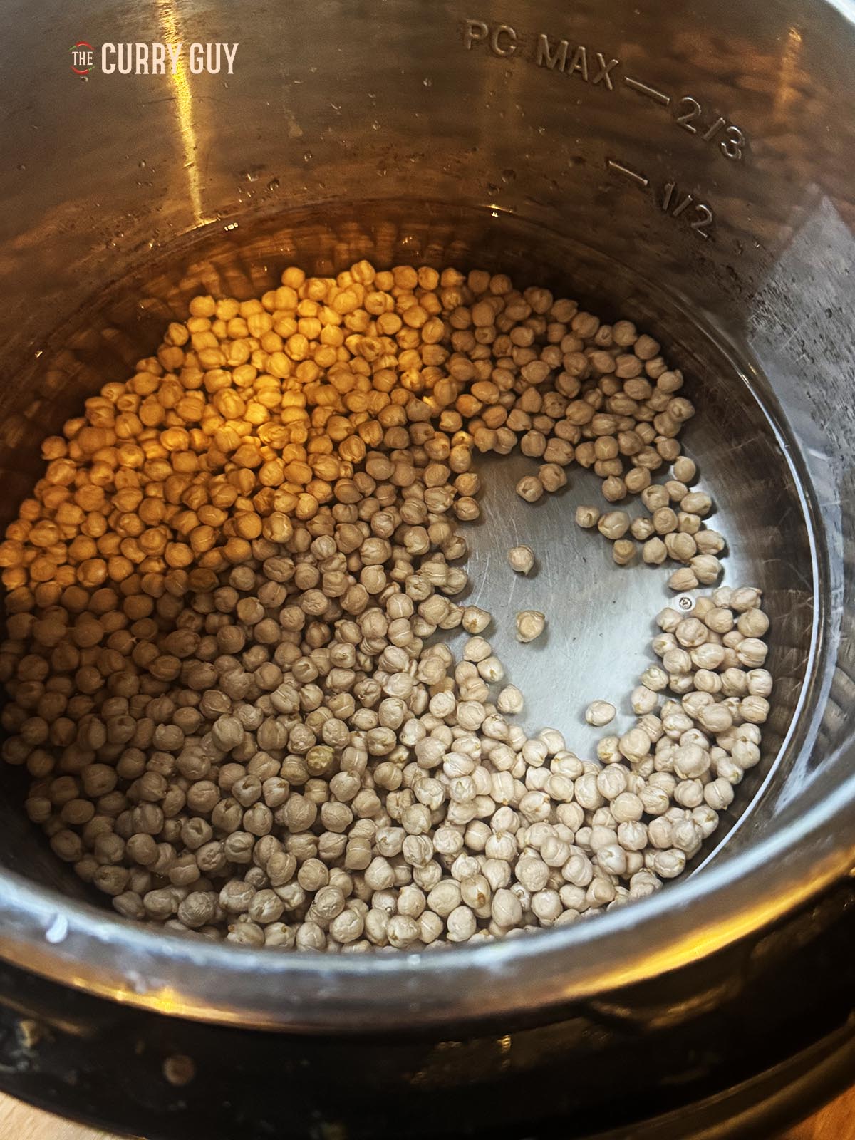 The dry chickpeas in.a pot to wash before cooking.