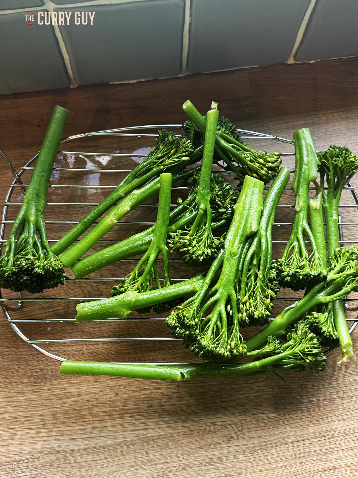 Steamed broccoli on a wire rack.