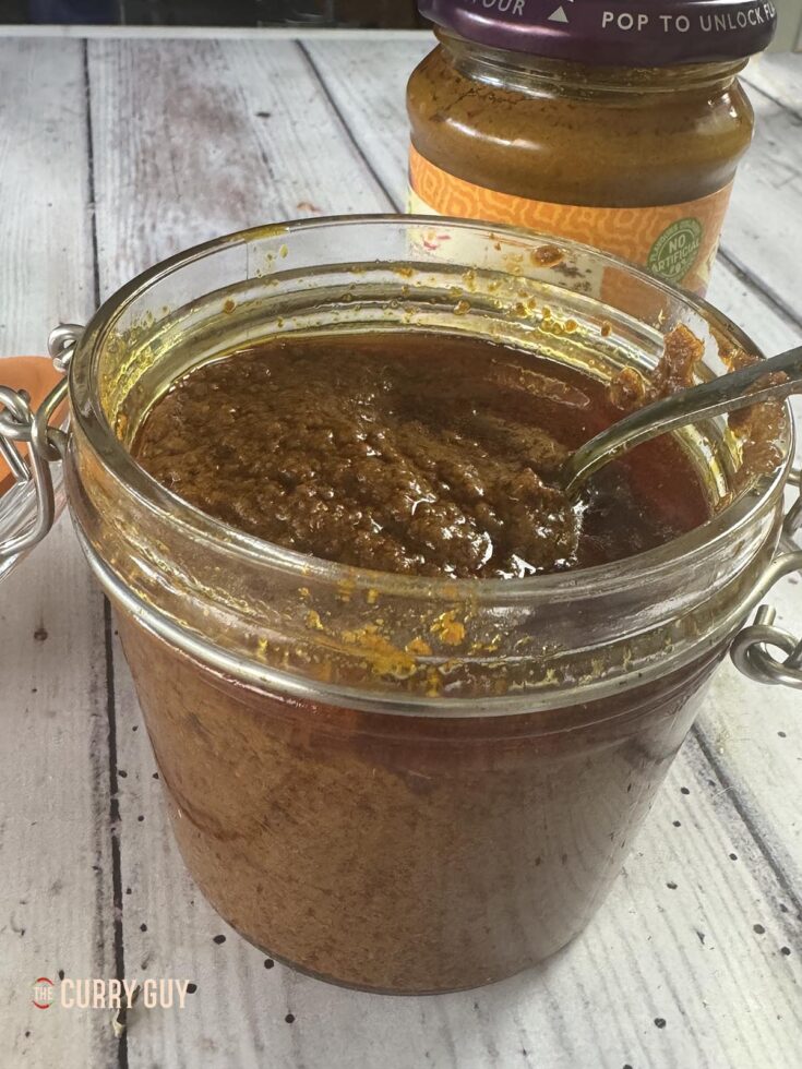 Tikka masala paste in a class jar ready to use next to a well known brand of tikka masala paste.