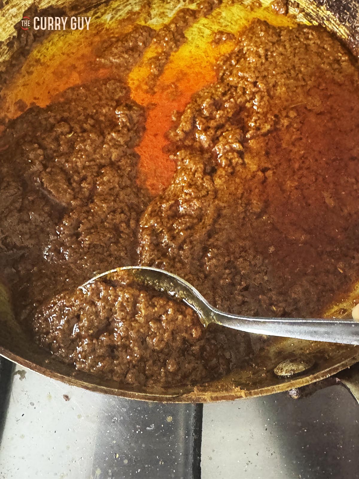 Transferring the spice paste to a jar.