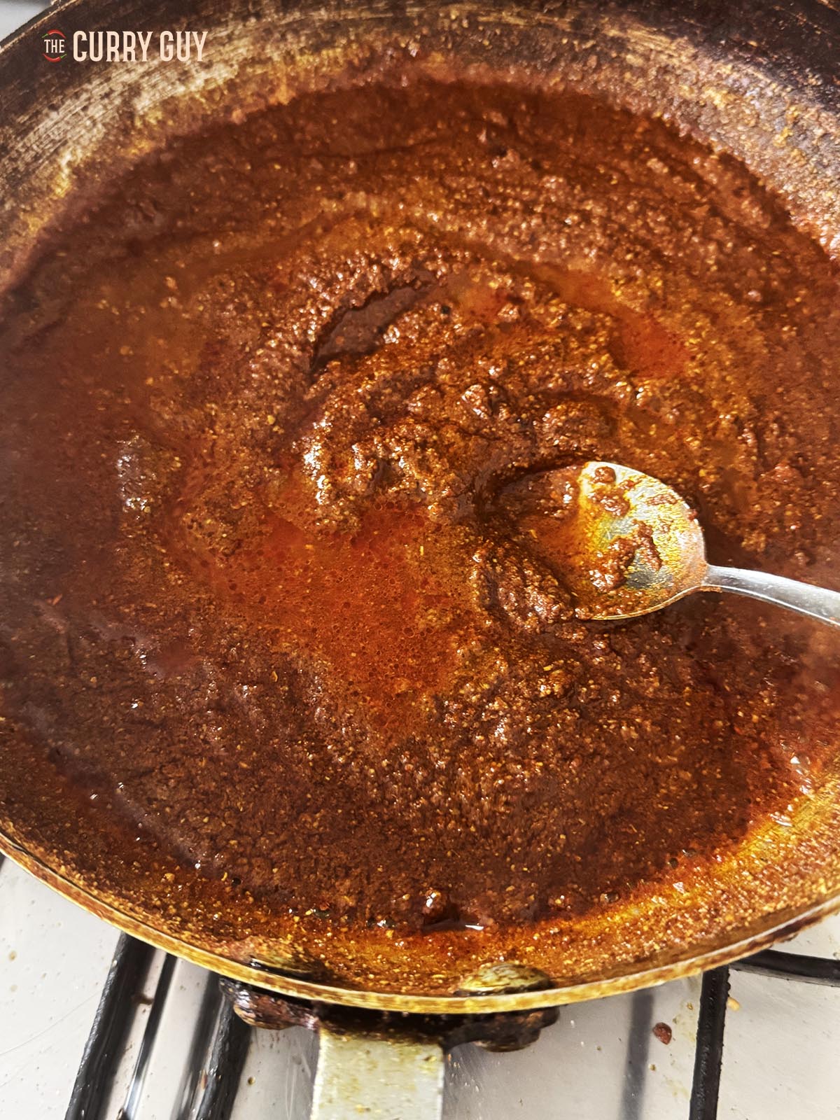 Adding the vinegar to the pan.