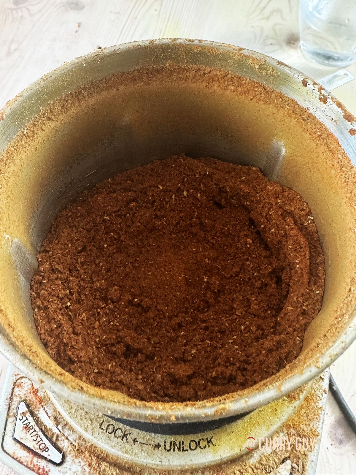 Adding the ground spices to the roasted and ground spices.