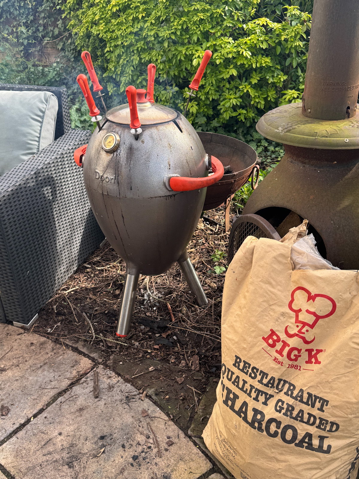 The Chicken Skewers cooking in the tandoor with the lid on.