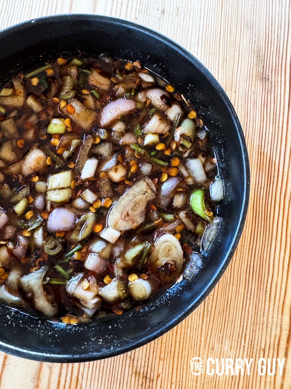 Nam jim jaew sauce in a serving bowl.