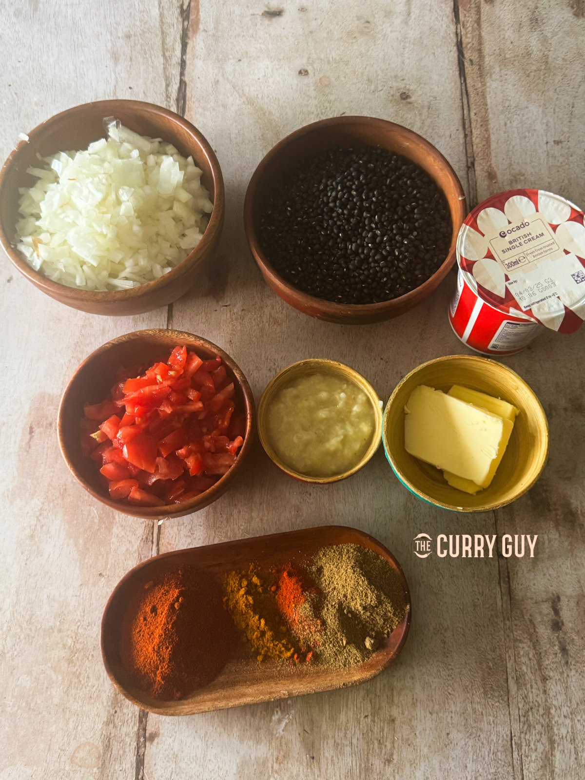 The ingredients for dal makhani laid out on a countertop. 