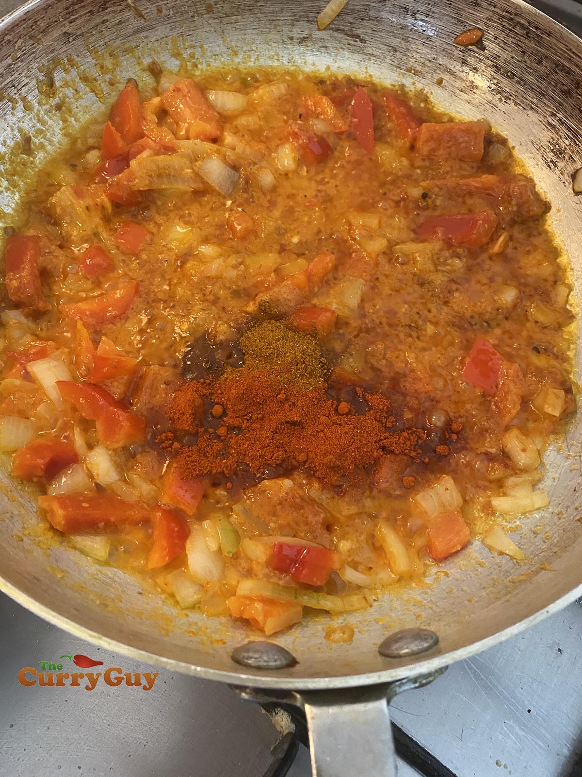adding spices to the pan