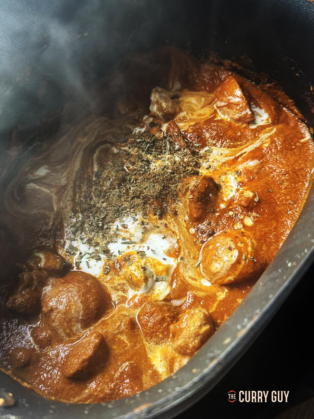 Adding the yoghurt and kasoori methi just before serving.
