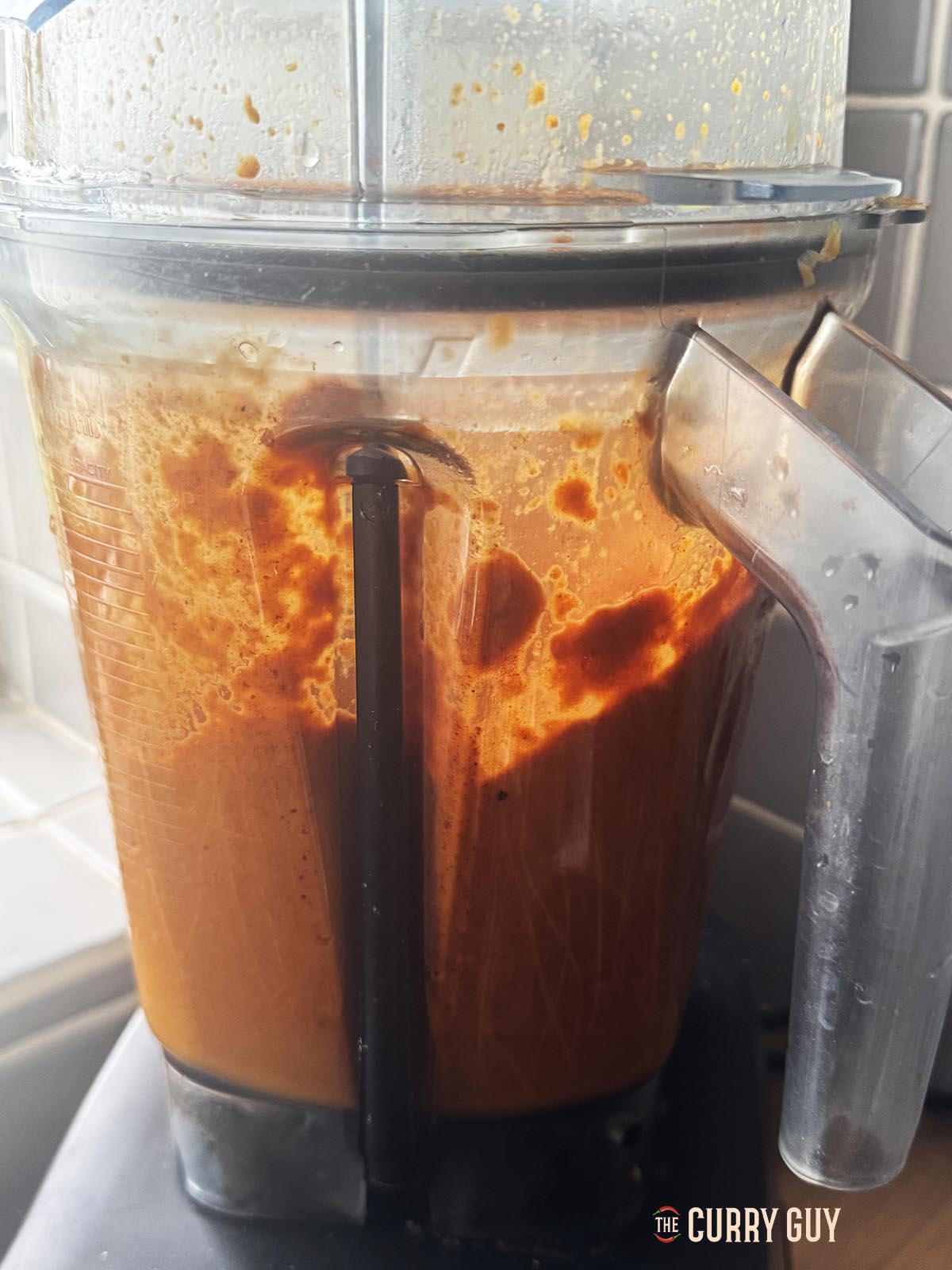Blending the sauce until smooth.