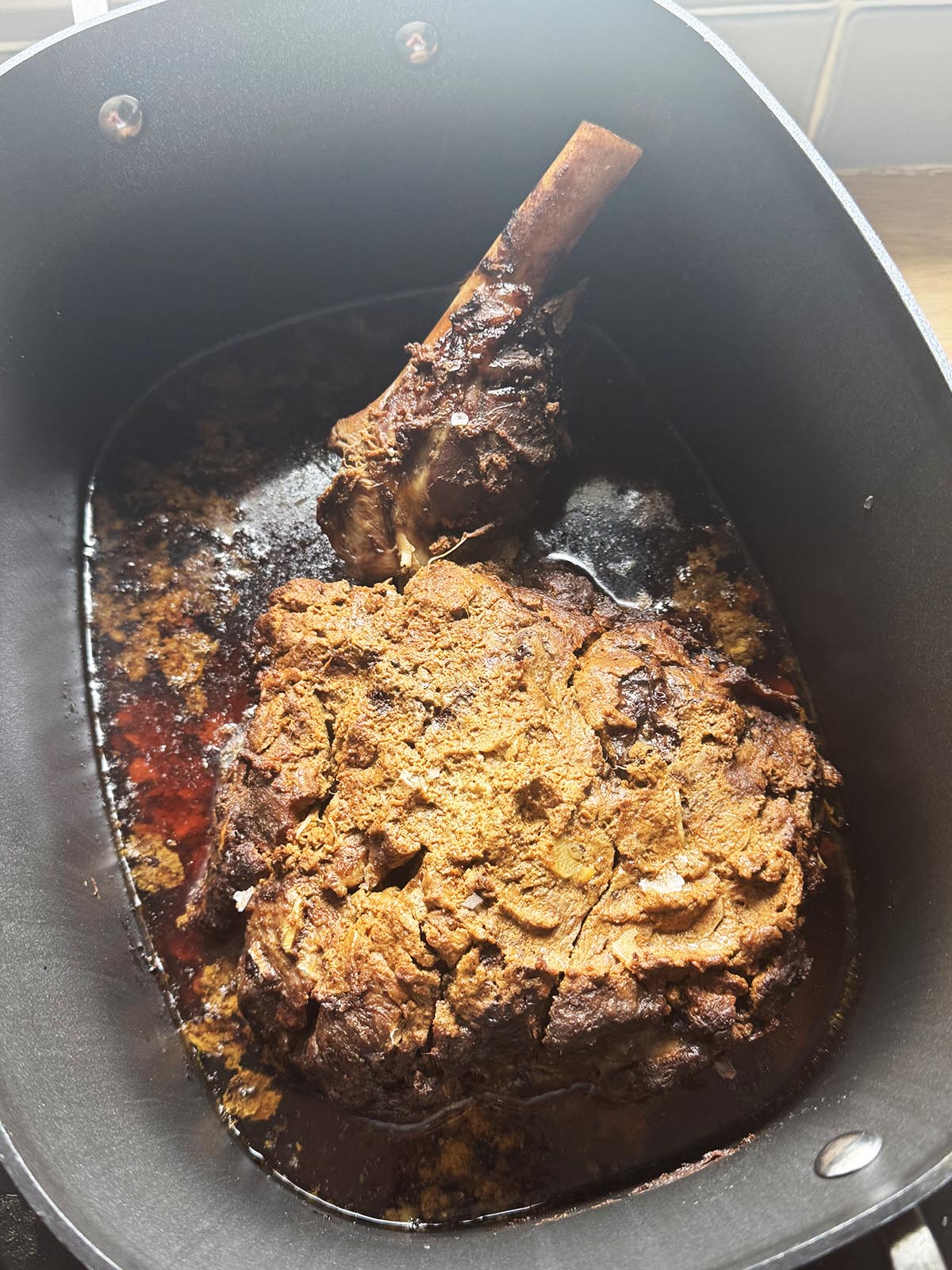 The leg of lamb after cooking for 10 hours.