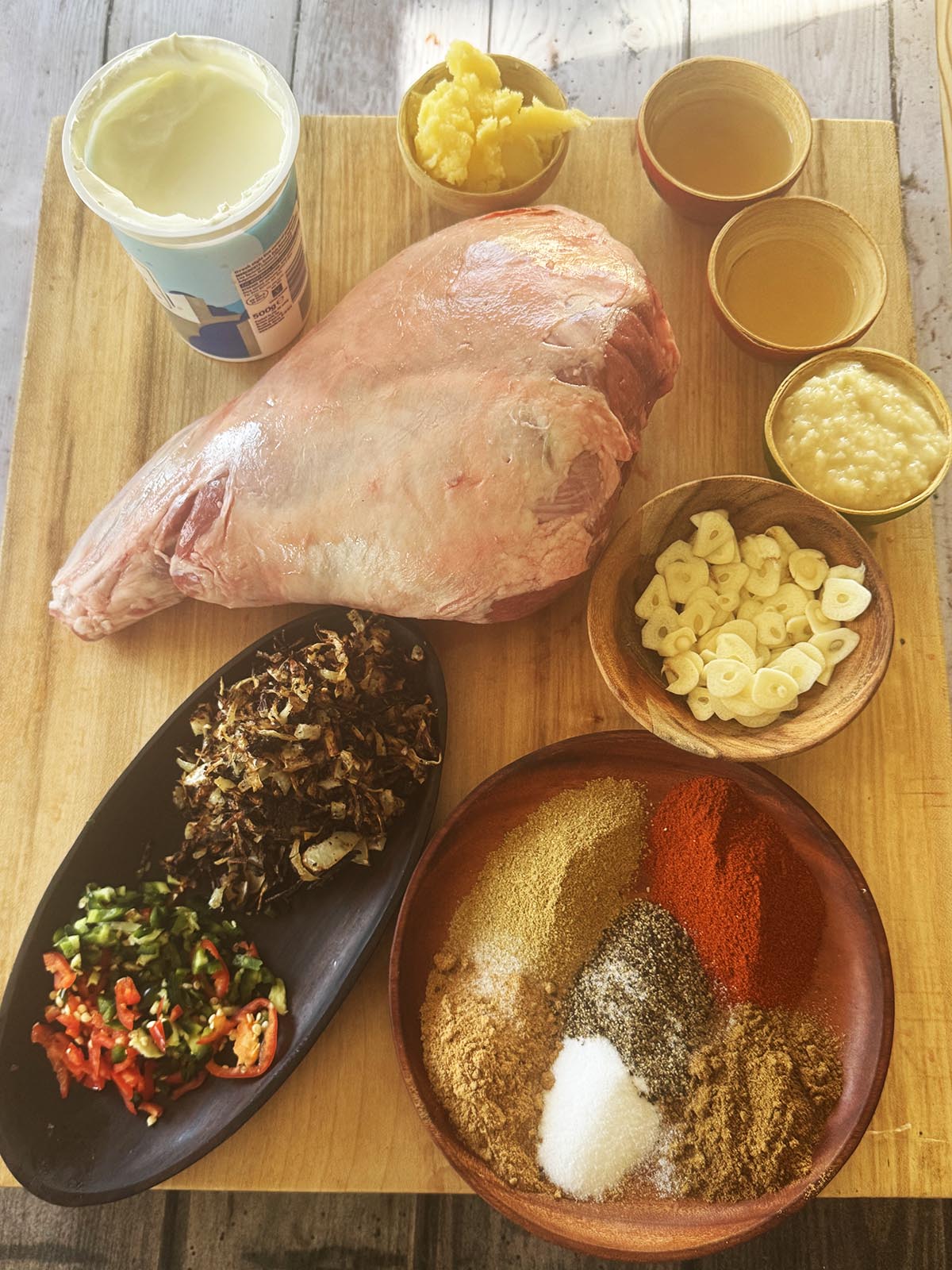The ingredients for the lamb raan laid out on a table and ready to use.