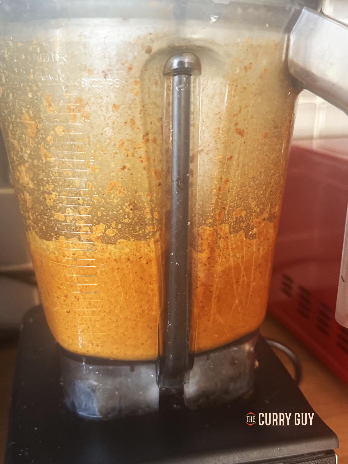 Blending the onion sauce until smooth.