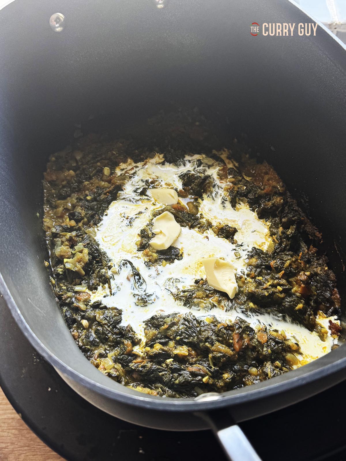 Adding the cream and butter before serving.