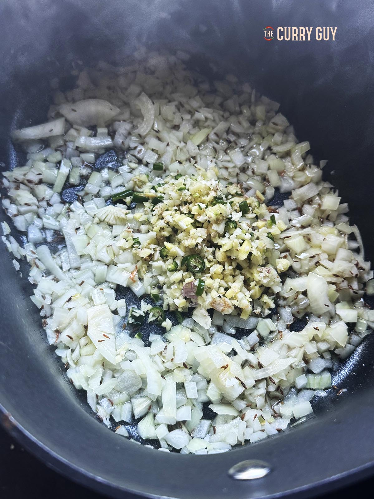 Adding the garlic an ginger to the fried onions.