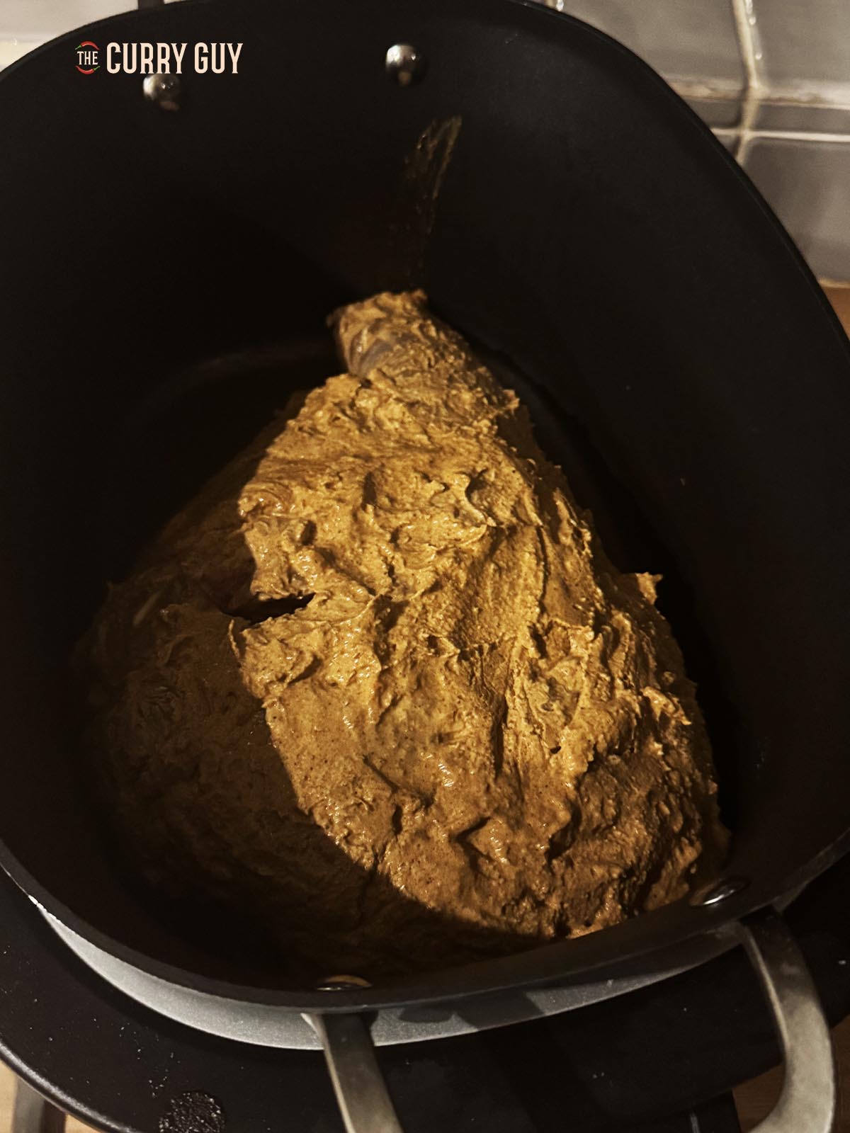 Lamb leg with all the marinade placed in the slow cooker to cook.