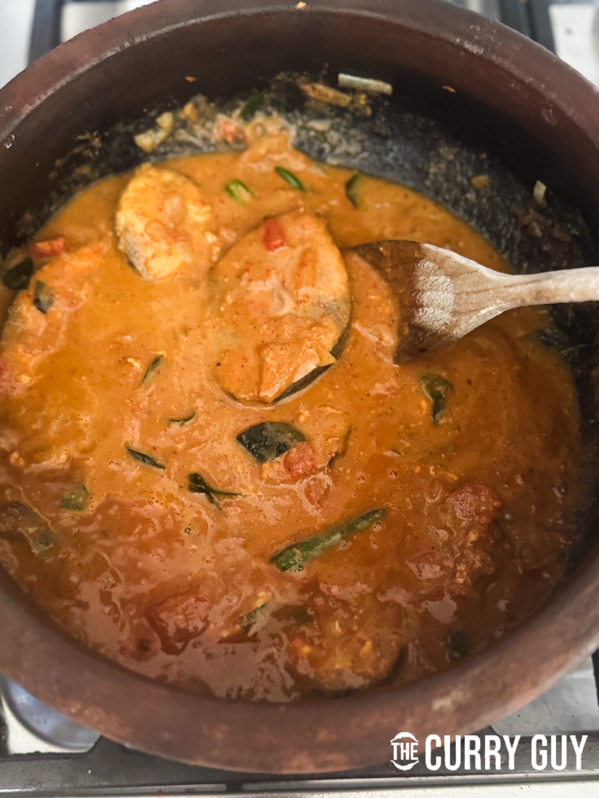 Bringing it all to a simmer to cook the fish