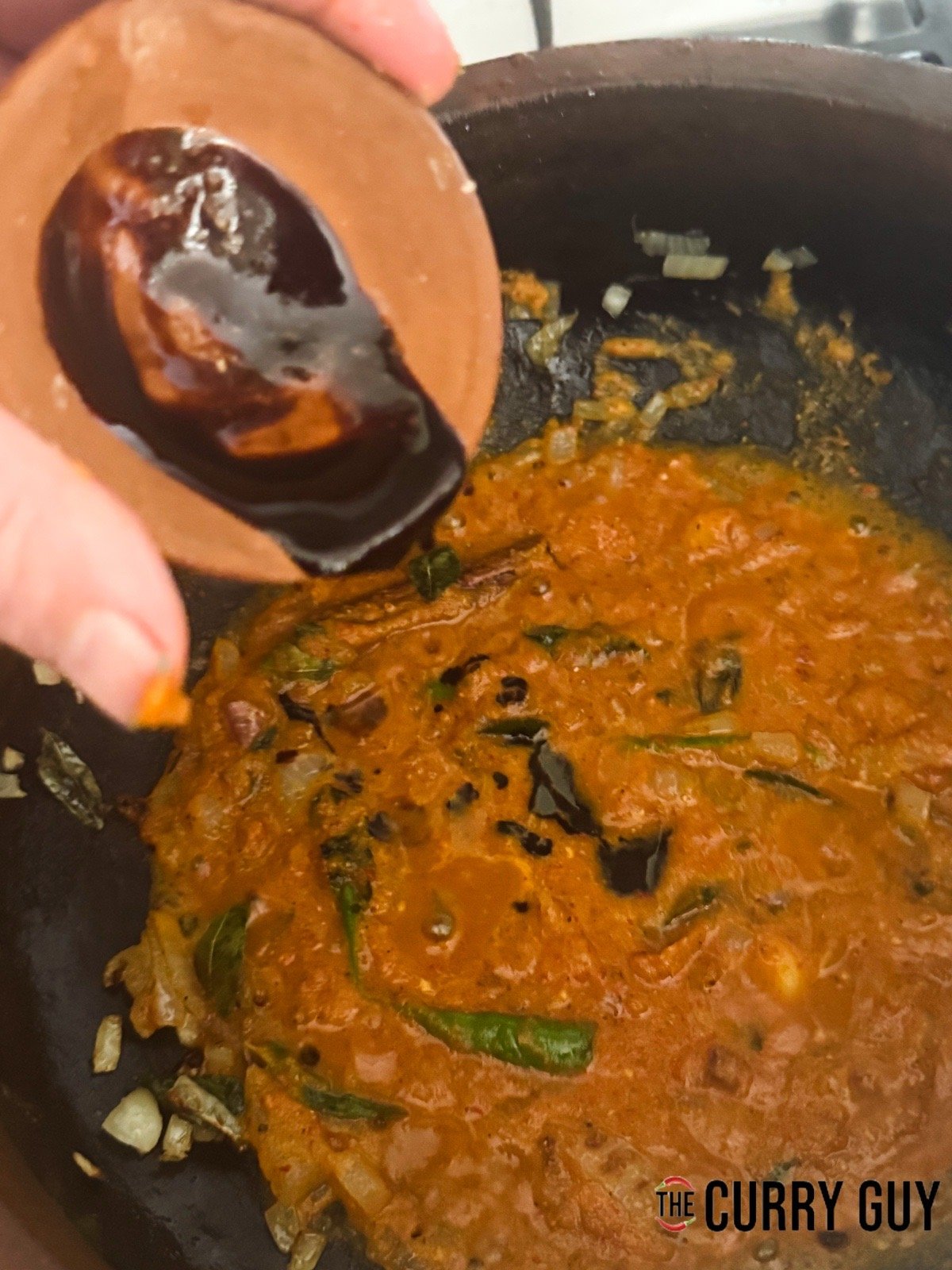 Bring the ingredients in the pan to a sizzle and then stirring in the tamarind concentrate.