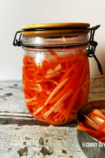Vietnamese pickled carrots with daikon in a preserve jar.