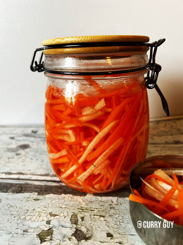 Vietnamese pickled carrots with daikon in a preserve jar.