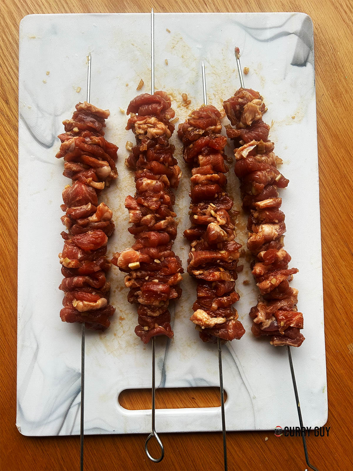 The marinated pork on skewers ready for the oven.