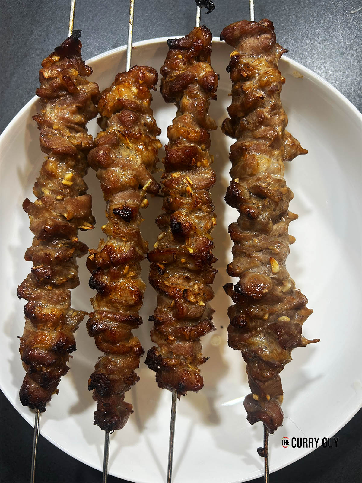 The cooked pork on skewers ready to start building the pork banh mi