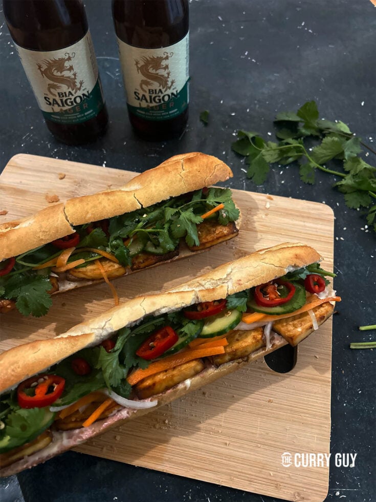 Finished tofu banh mi sandwiches on a serving platter.