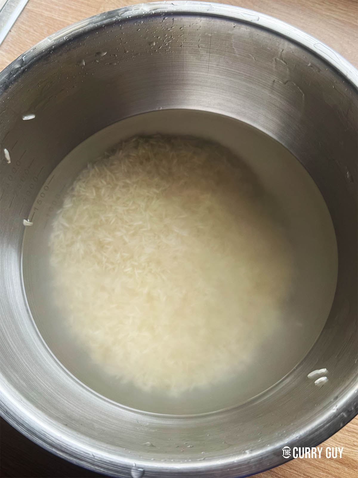 The rice soaking in water after being washed.