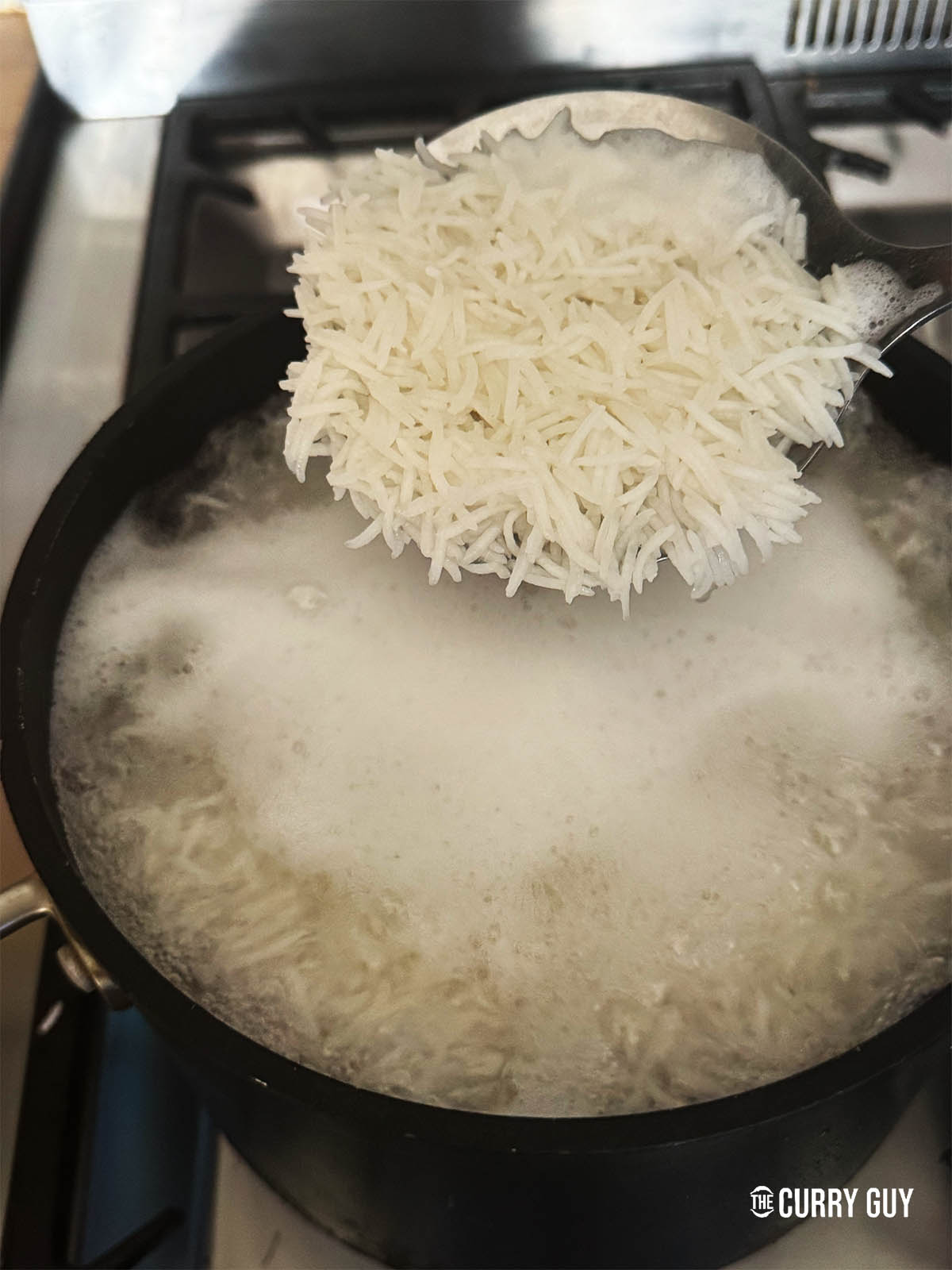 The rice cooked and ready to strain.