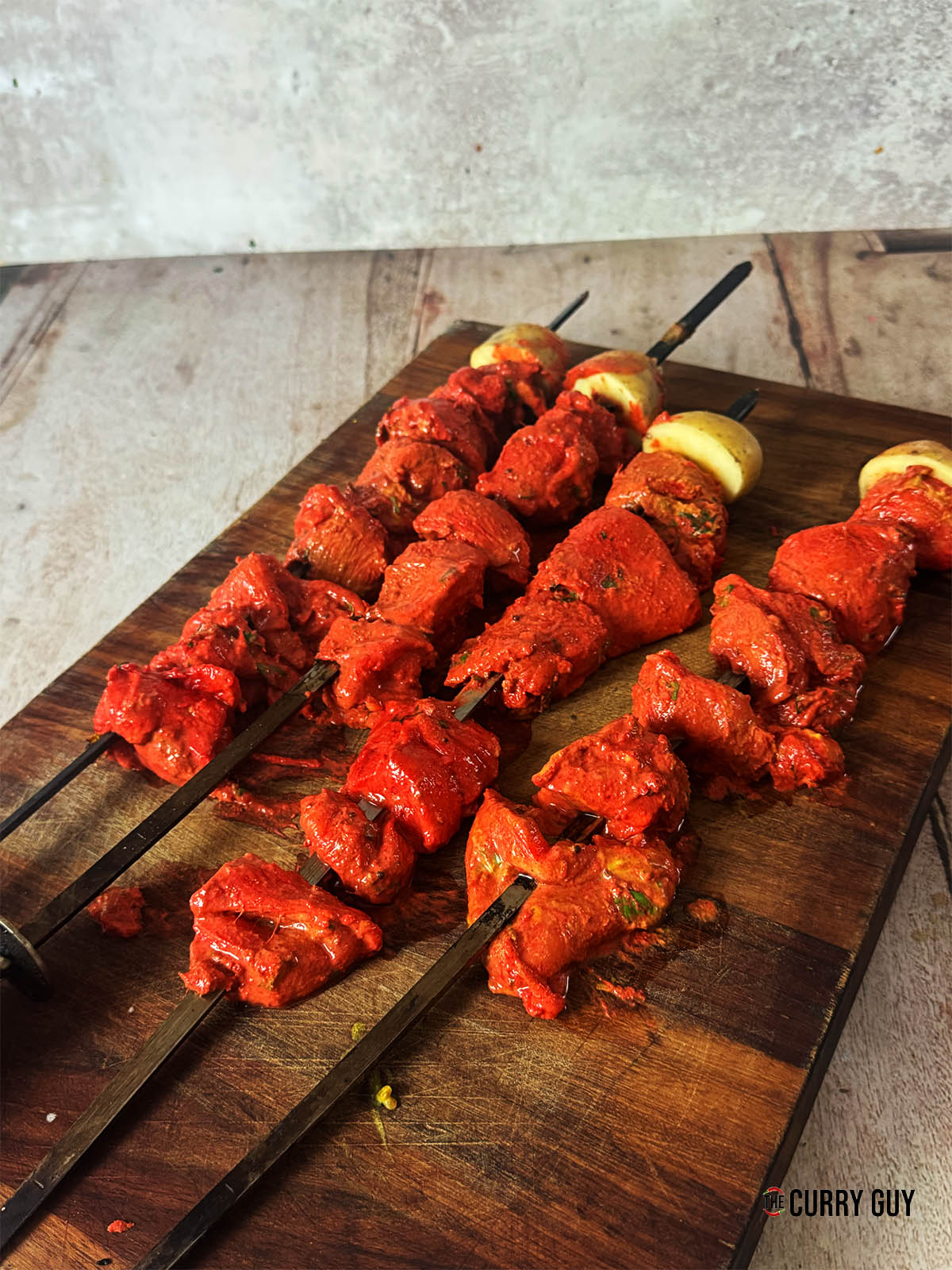 Skewering the chicken